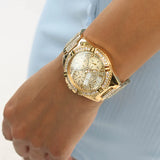 Guess - U1156L2 - Montre multifonction dorée à strass